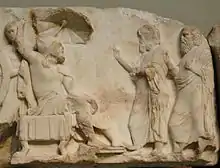 Arbinas, in Persian dress, receives emissaries. Nereid Monument.