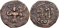 Coin of the Rashidun Caliphate with figure of Constans II standing facing, holding cross-tipped staff and globus cruciger. Pseudo-Byzantine types. Struck circa 647–670.