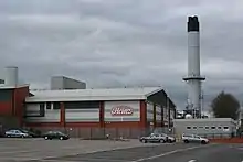 Image 16Heinz, although based in Hayes in Middlesex, has the largest food processing complex in Europe at a 55-acre (22 ha) site at Kitt Green in Wigan, which produces 1.4 billion cans of food each year; it is accessed to the east of the Orrell Interchange of the M6 (A577); the 38-acre Heinz NDC is next door (from North West England)